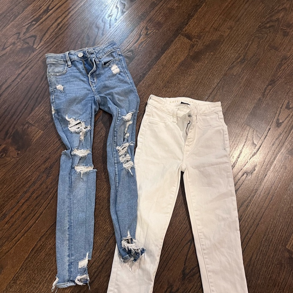 2 American Eagle jeans.. 2 pairs white high rise and skinny. Blue mid rise riped